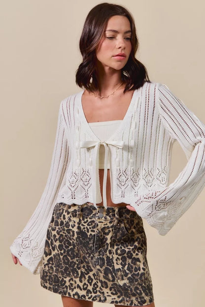 Off-white Trendsi SO ME textured sweater with open front and ribbon tie, cozy knit cardigan for casual wear.