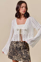 Off-white Trendsi SO ME textured sweater with open front and ribbon tie, cozy knit cardigan for casual wear.
