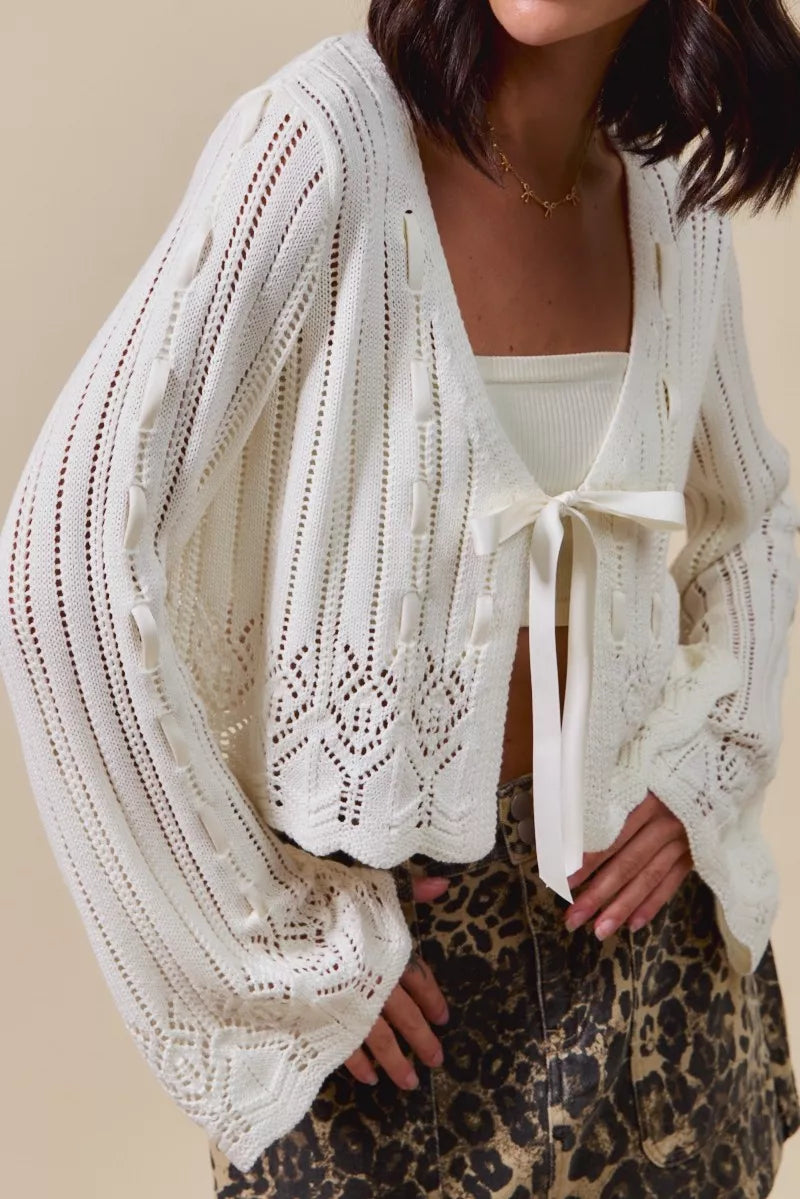 Off-white SO ME textured sweater open front cardigan with ribbon tie, stylish and cozy Trendsi knitwear for casual wear.