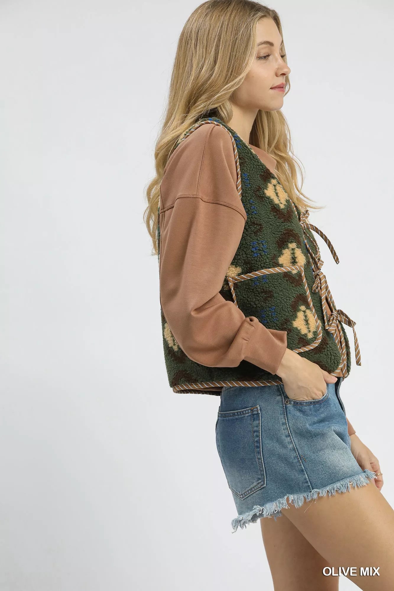 Olive mix Umgee patterned Sherpa tie-front vest with cozy fabric and stylish design, perfect for layered fall outfits.