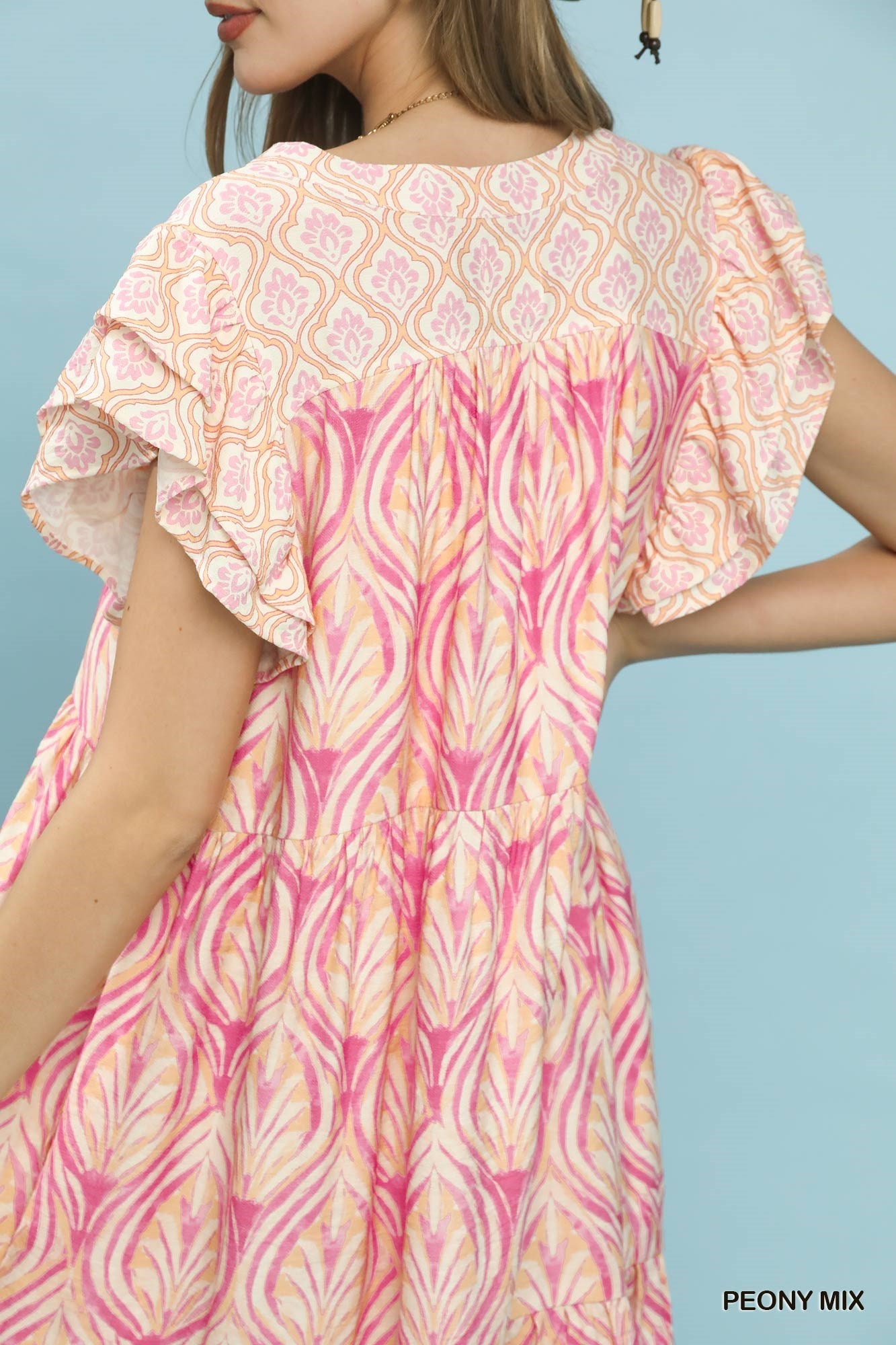 Umgee Mix Printed Flutter Sleeve Dress featuring a floral pattern and flutter sleeves, perfect for casual or semi-formal wear.