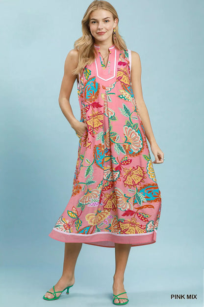 Pink paisley floral sleeveless midi dress by Umgee, featuring a flowy silhouette and vibrant pattern.