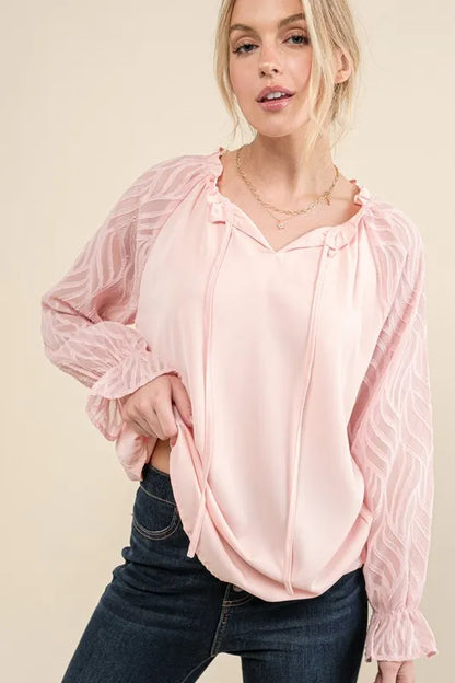 Pink textured sleeve blouse with leaf shape design from Trendsi, featuring a stylish and trendy leaf pattern on the fabric.