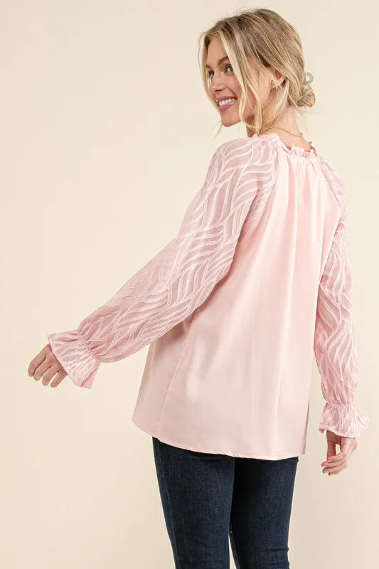 Pink textured sleeve blouse with leaf shape design from Trendsi, featuring a stylish, flowy fit and unique leaf pattern.