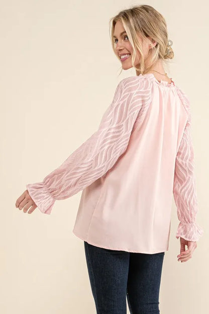 Pink textured sleeve blouse with leaf shape design from Trendsi, featuring a stylish, flowy fit and unique leaf pattern.