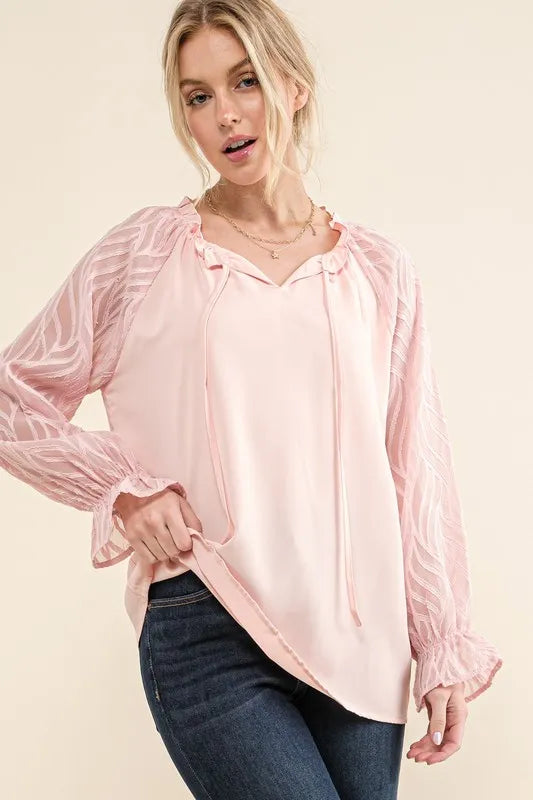 Pink textured blouse with leaf-shaped sleeves by Trendsi, featuring a stylish and unique design.