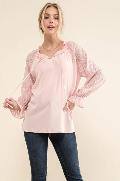 Pink textured sleeve blouse with leaf-shaped design from Trendsi, featuring a stylish and flowy fit.