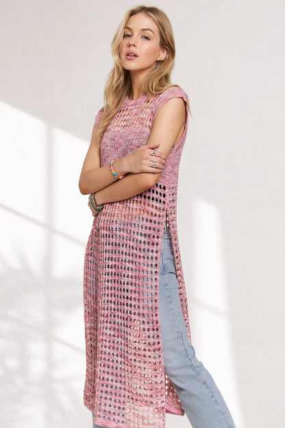 Pink multi-color crochet tunic top with long sleeves and relaxed fit, stylishly displayed on a hanger.
