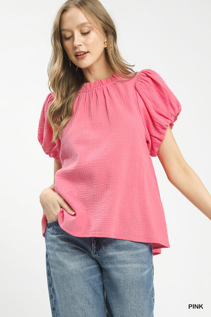 Pink Umgee textured gauze boho top with ruffle neckline, featuring a relaxed fit and stylish, casual design.