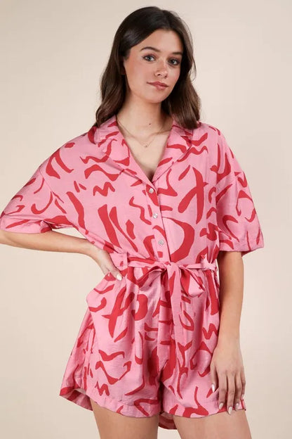Pink oversized printed button-down resort romper by VERY J, featuring a relaxed fit and stylish summer design.