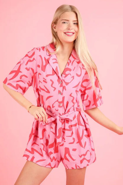 Pink oversized printed button-down resort romper by VERY J, stylish and comfortable for warm-weather wear.
