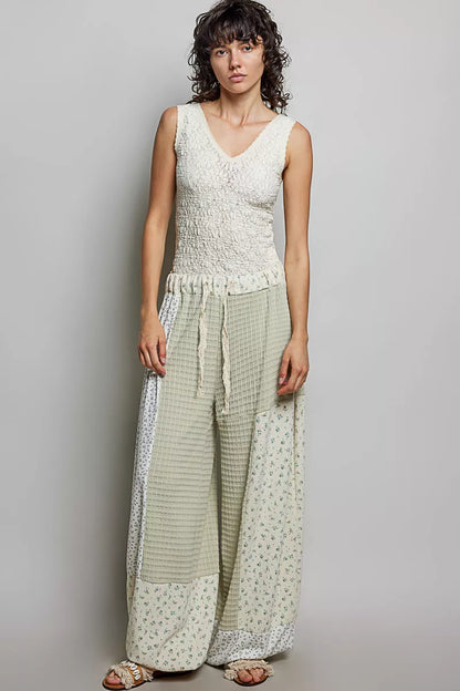 Sage multi-colored patchwork knit wide-leg pants from Trendsi, showcasing a relaxed fit and mixed knit design.