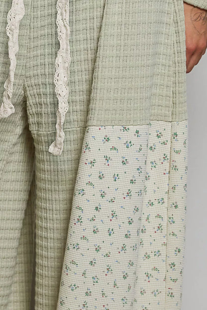 Sage patchwork mixed knit wide-leg pants by Trendsi with a relaxed fit and stylish design, shown on a model.