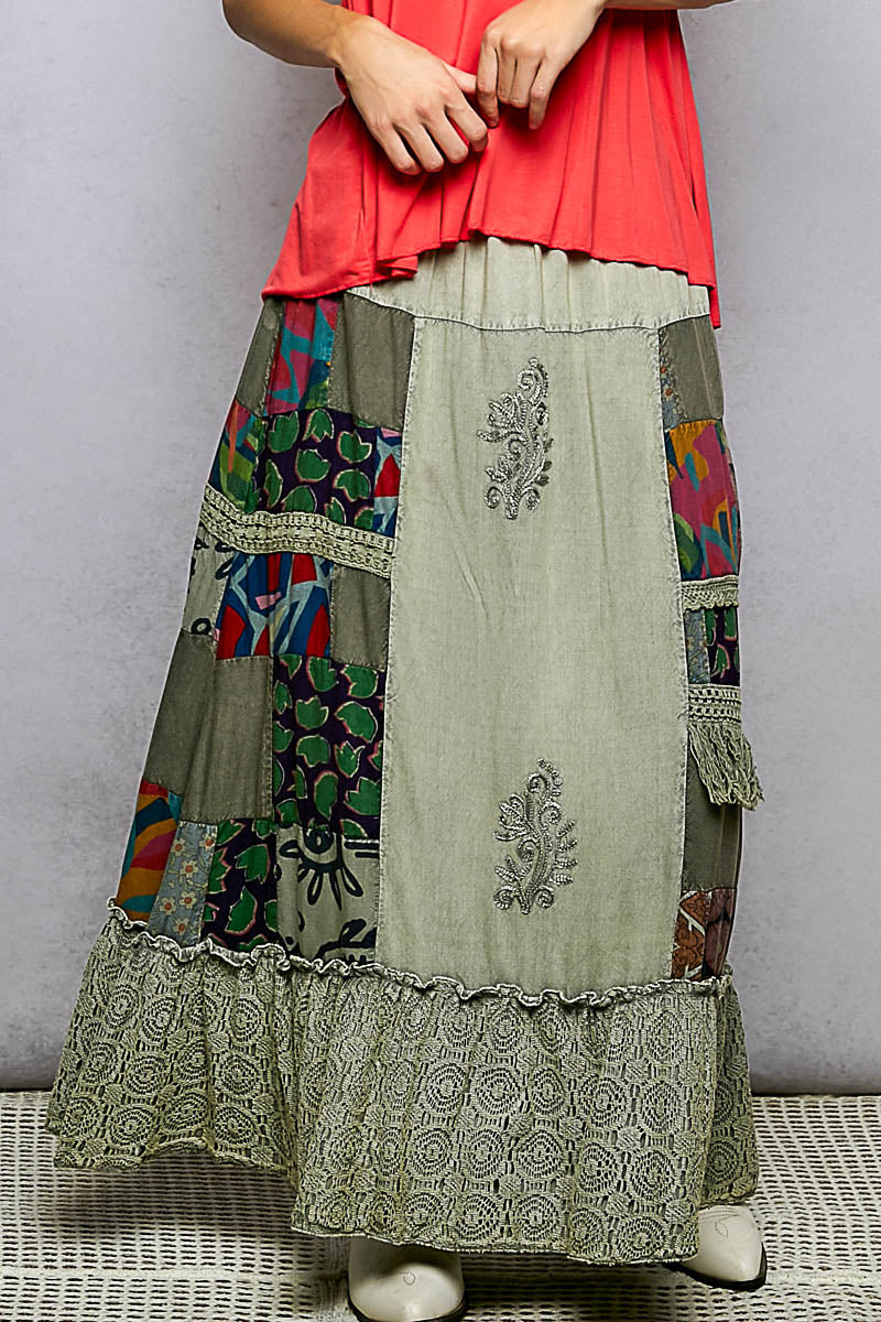 Sage multi-color patchwork embroidered ruffled skirt by Trendsi featuring intricate embroidery and flowing ruffle details.