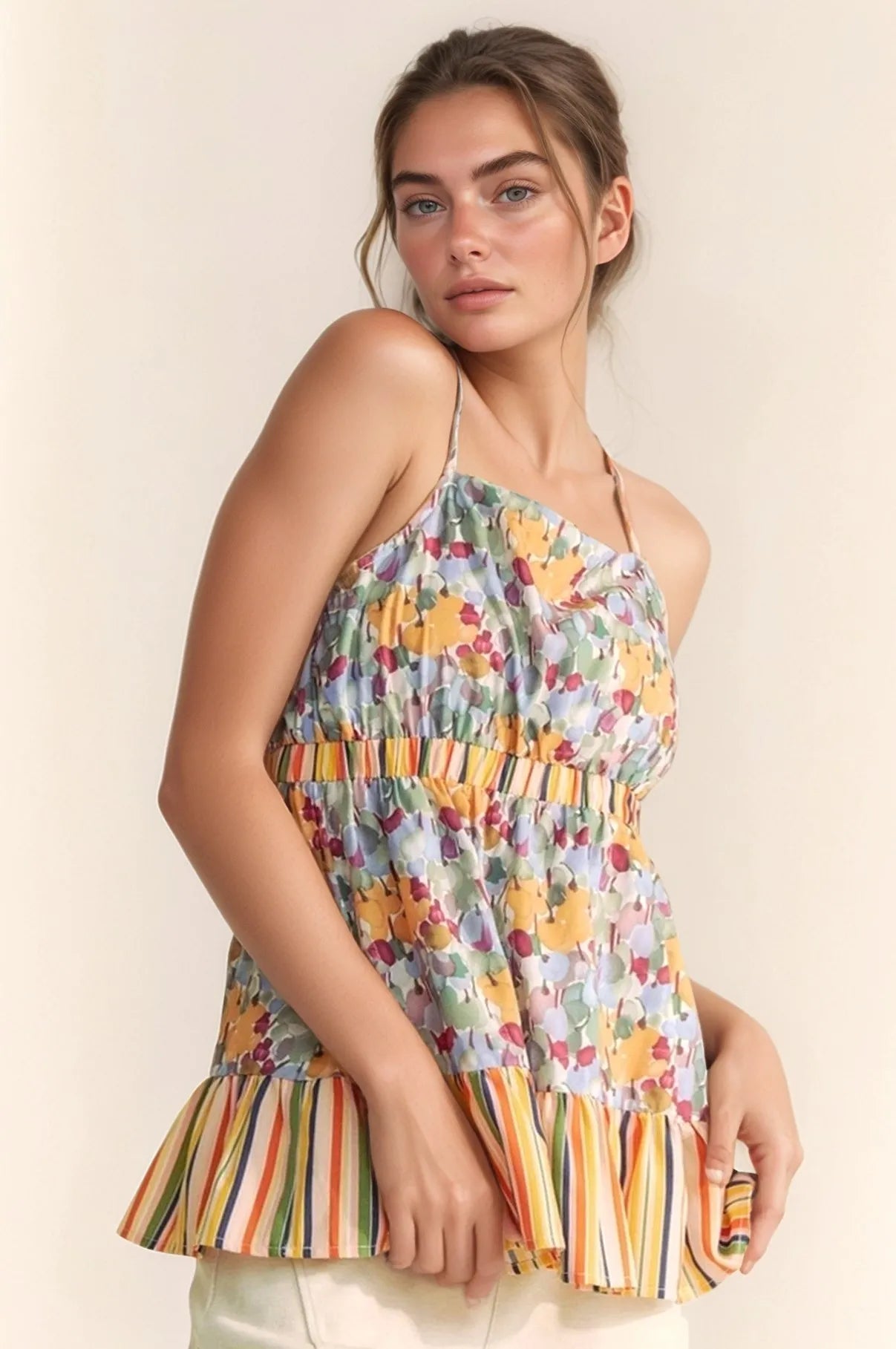 Sage floral smocked sleeveless ruffle back tie top by Davi & Dani, featuring floral print and ruffle details.