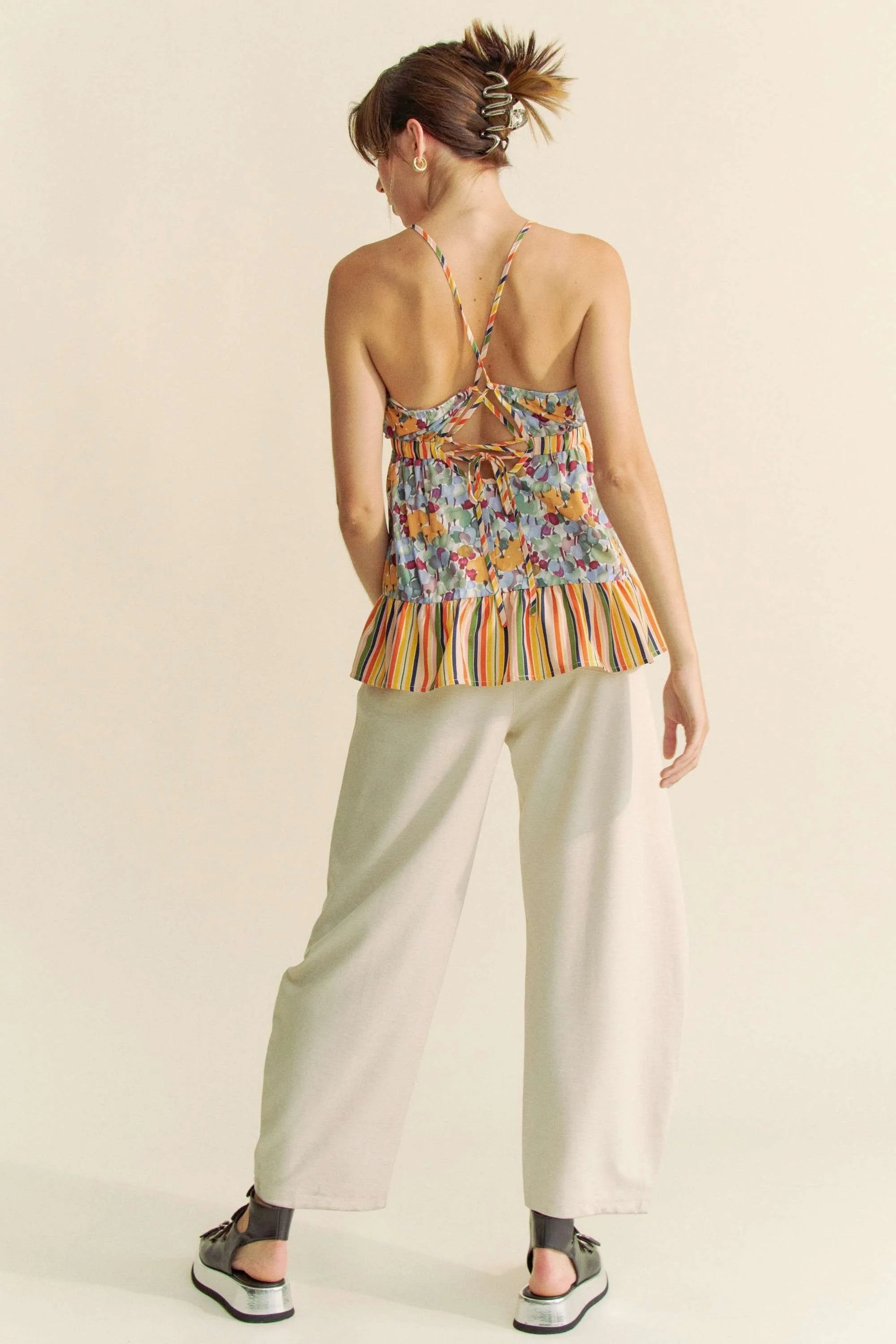 Sage Davi & Dani floral smocked sleeveless ruffle back tie top by Trendsi, featuring a floral pattern and ruffle details.