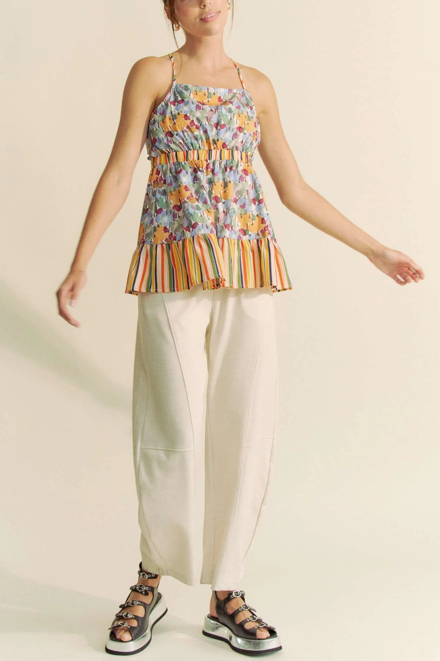 Sage floral smocked sleeveless ruffle back tie top by Davi & Dani, featuring a feminine design and delicate ruffle details.