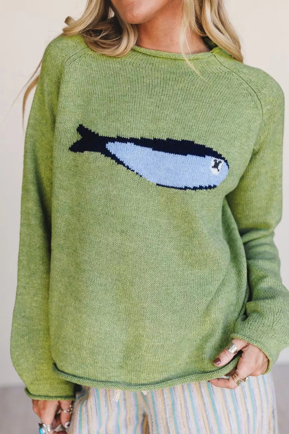 Sage green Fish Graphic round neck sweater by Trendsi, featuring a vibrant fish illustration on soft knit fabric.