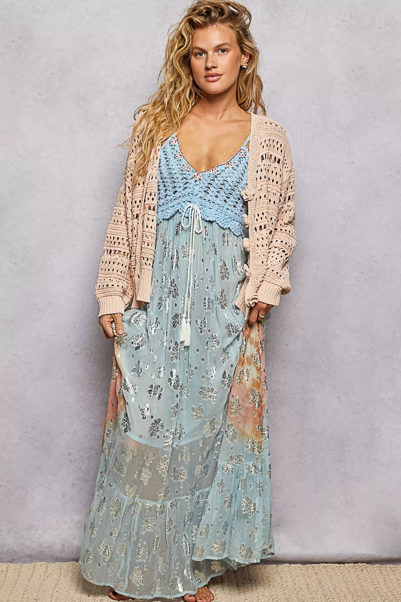Salmon-pink POL open-knit floral button cardigan by Trendsi, showing a lightweight knit with floral patterns and front buttons.
