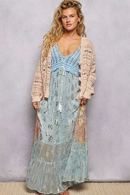 Salmon-pink POL open-knit floral button cardigan by Trendsi, showing a lightweight knit with floral patterns and front buttons.
