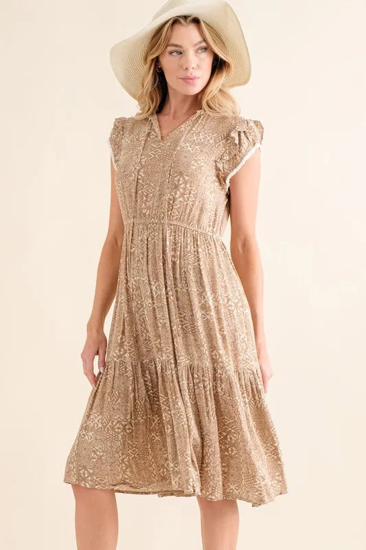 Taupe boho printed tiered maxi dress by Trendsi, featuring a flowy silhouette and intricate pattern for a relaxed, stylish look.