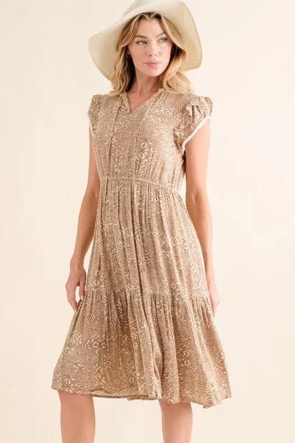 Taupe boho printed tiered maxi dress by Trendsi, featuring a flowy silhouette and intricate pattern for a relaxed, stylish look.