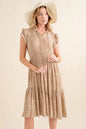 Taupe boho printed tiered maxi dress by Trendsi featuring flowing fabric and a relaxed, layered design.