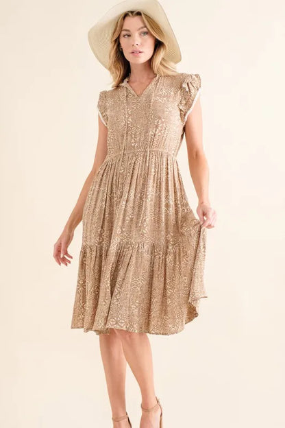 Taupe boho printed tiered maxi dress by Trendsi featuring flowing fabric and layered design.