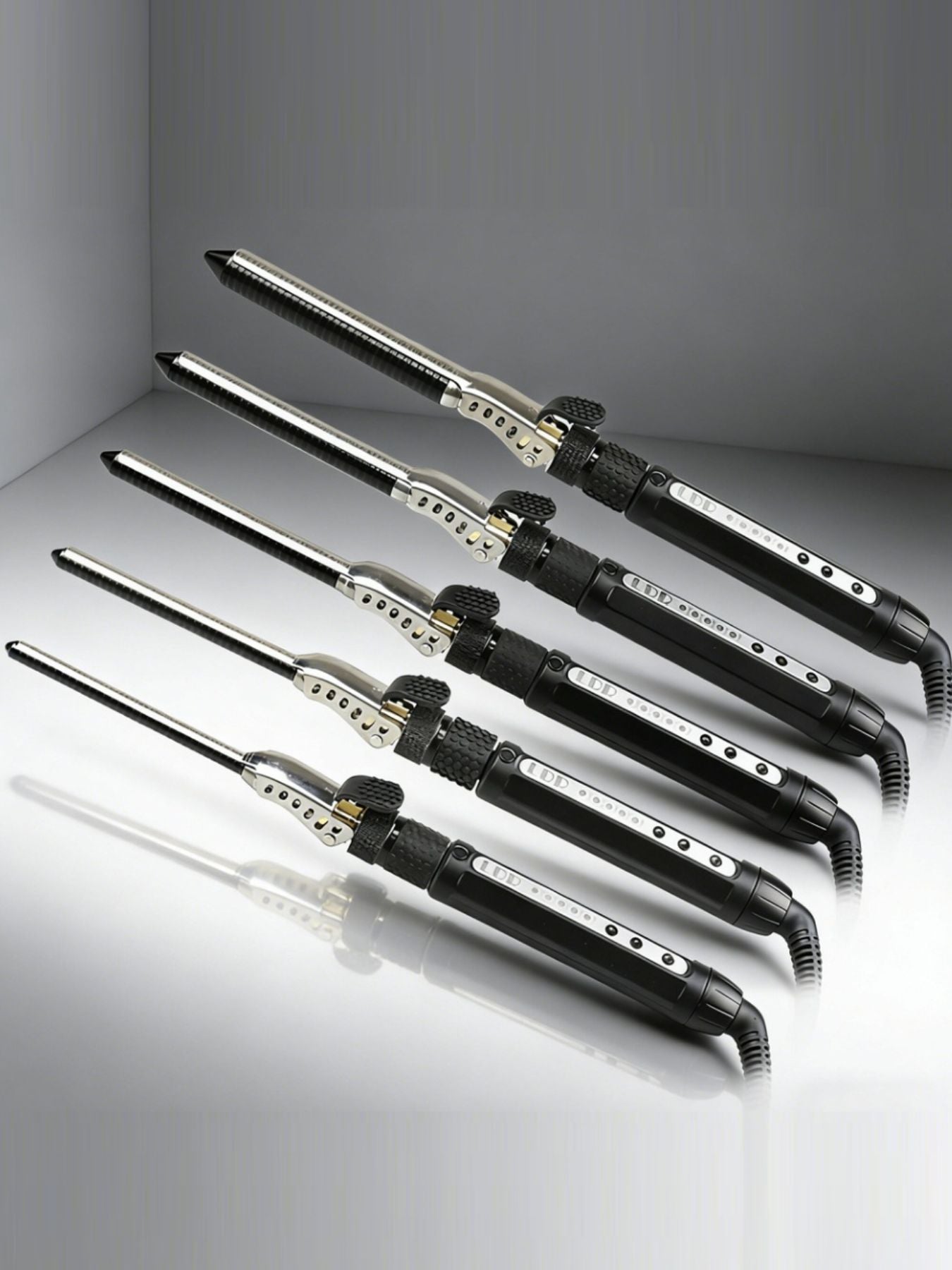 Trendsi 7mm adjustable temperature curling iron with European plug, showing a professional styling tool for curling hair.