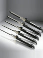 Trendsi 7mm adjustable temperature curling iron with European plug, showing a professional styling tool for curling hair.