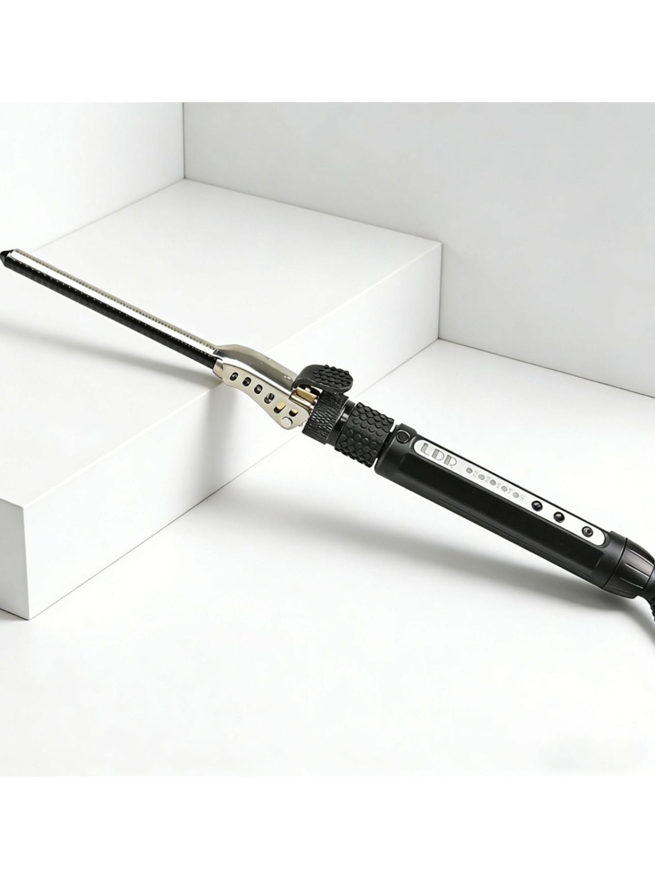 Trendsi adjustable temperature curling iron with a 7mm barrel and European plug, suitable for creating stylish curls and waves.