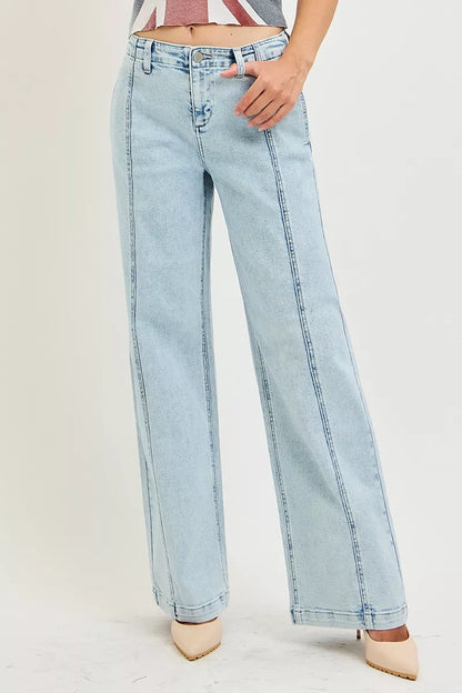 Light acid-wash RISEN slouchy wide-leg jeans from Trendsi, showcasing relaxed fit and casual style with visible distressed details.