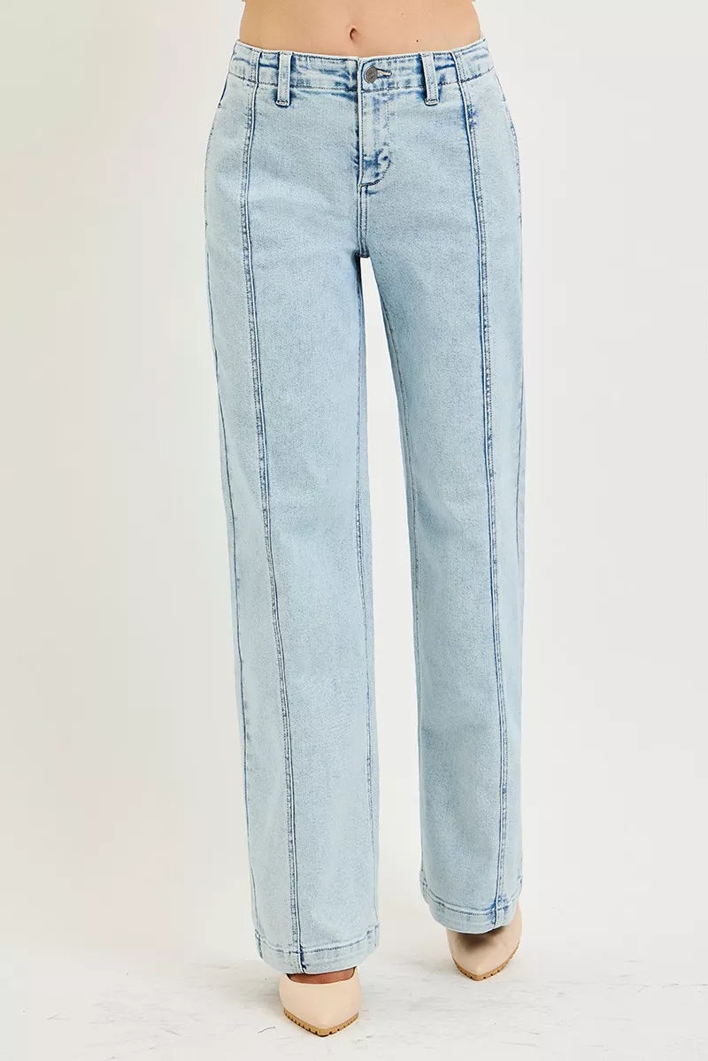 Light acid-wash RISEN slouchy wide-leg jeans from Trendsi, showing relaxed fit and stylish distressed details.