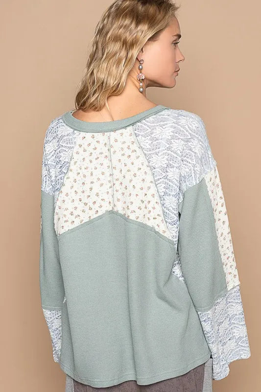 Air-force blue POL Lace floral round neck knit top by Trendsi, featuring a delicate lace floral pattern and comfortable fit.