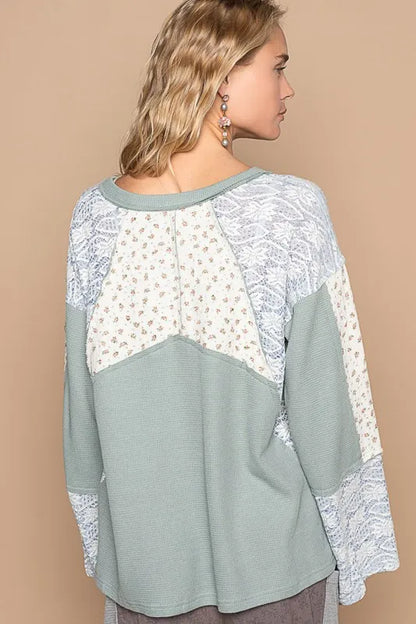 Air-force blue POL Lace floral round neck knit top by Trendsi, featuring a delicate lace floral pattern and comfortable fit.