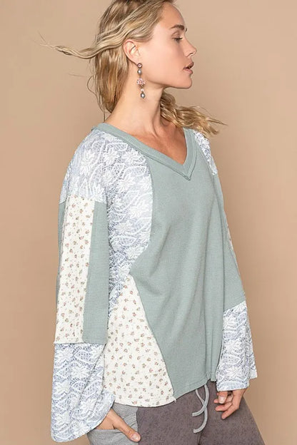 Air force blue POL Lace Floral Round Neck Knit Top by Trendsi, showcasing a close-up of the detailed lace floral pattern and round neckline.