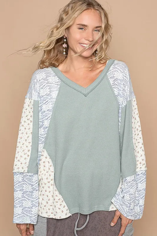 Air force blue POL lace floral round neck knit top by Trendsi, showing the detailed lace floral design and round neckline.