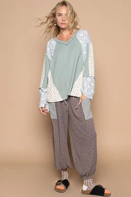 Air-force blue POL Lace floral round neck knit top by Trendsi, showing the detailed lace floral design and cozy knit fabric.