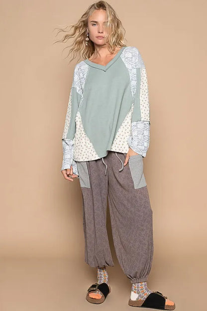Air-force blue POL Lace floral round neck knit top by Trendsi, showing the detailed lace floral design and cozy knit fabric.