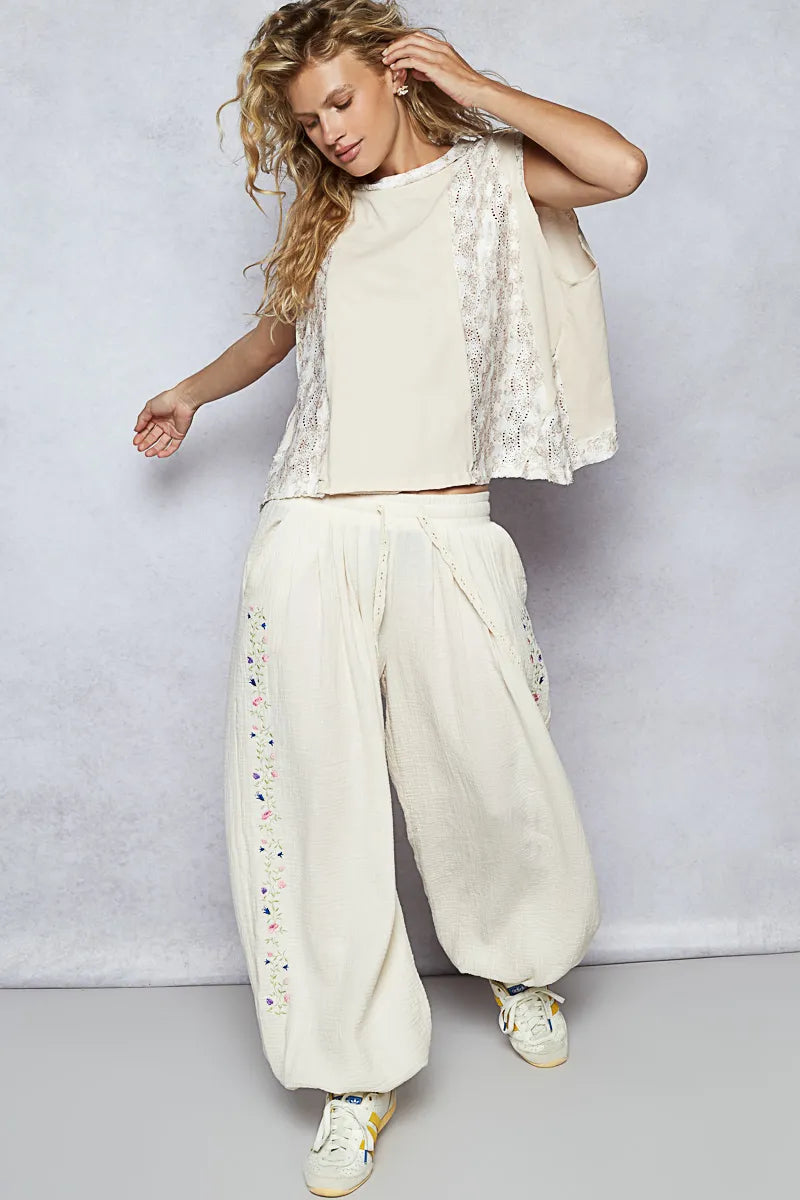 Almond-colored sleeveless top with round neckline and floral contrast detail, by Trendsi, for a stylish casual look.