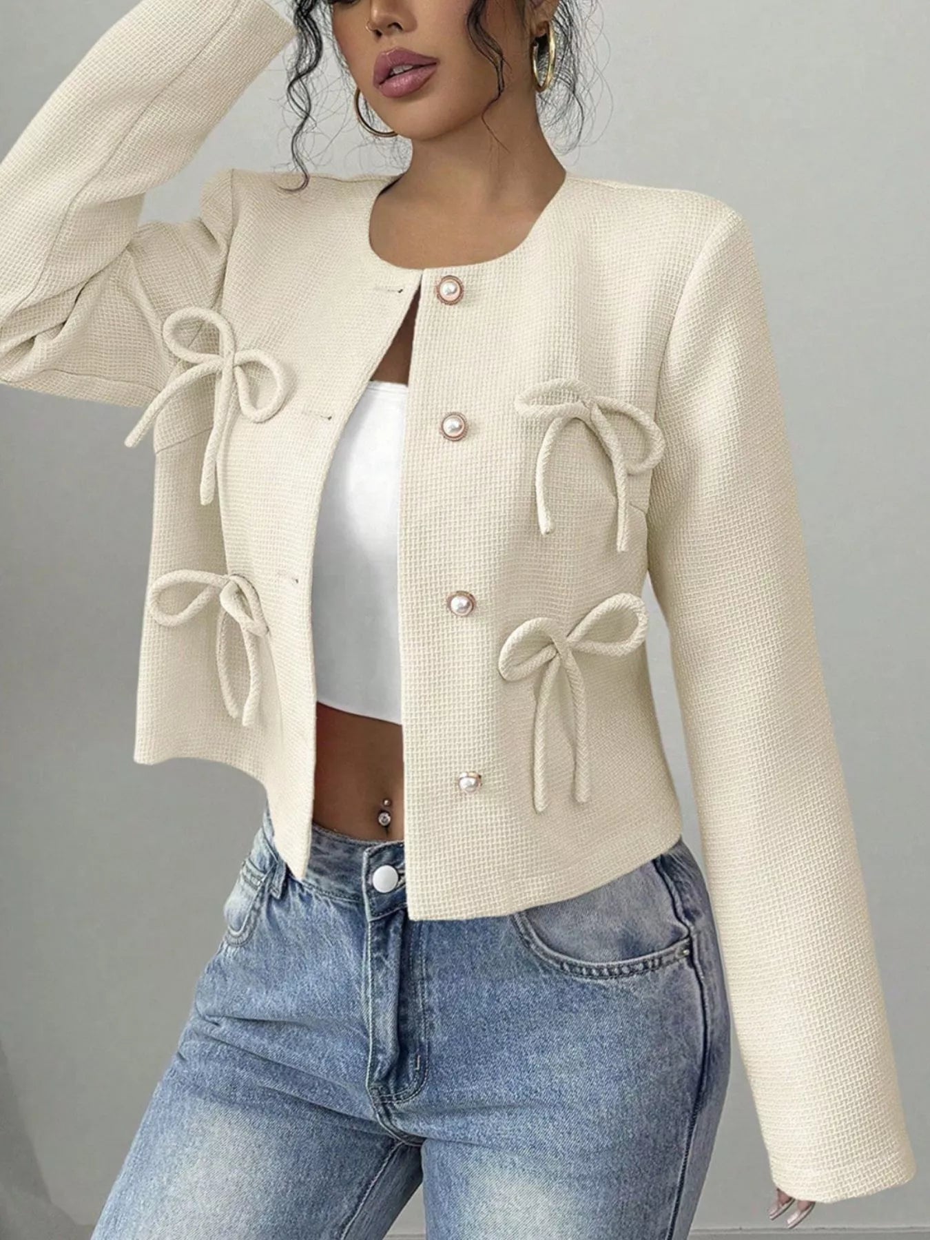 Apricot Bow Detail Cropped Outerwear from Trendsi, featuring a stylish bow accent and lightweight cropped design.