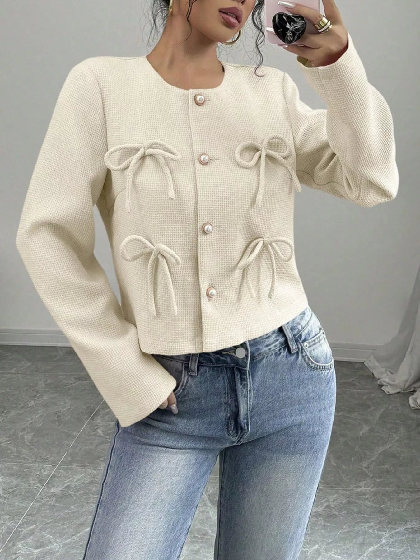 Apricot cropped outerwear by Trendsi with bow detail, featuring a stylish, lightweight jacket perfect for layered fall outfits.