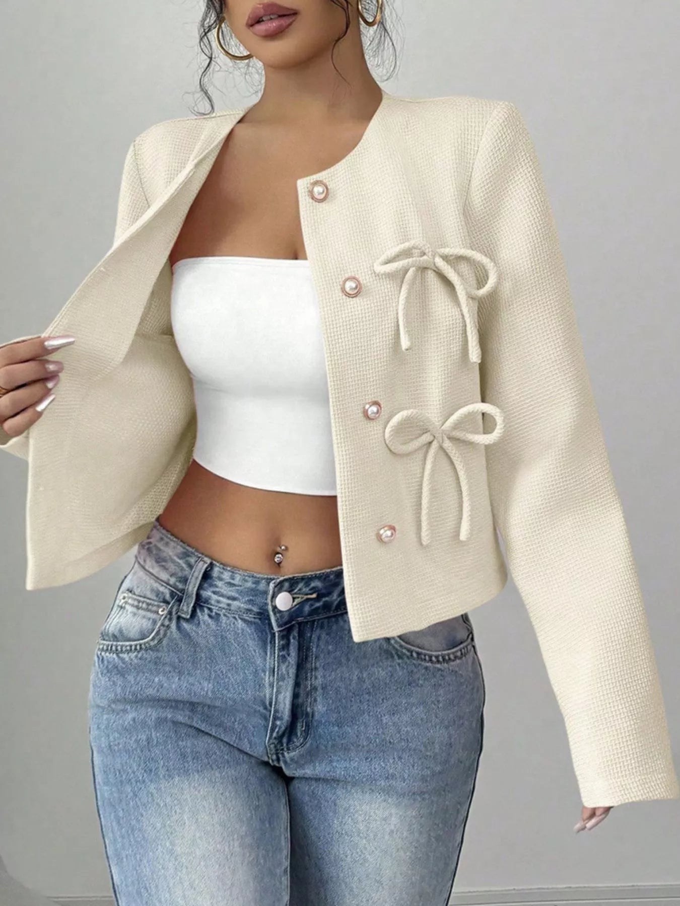 Apricot-colored Trendsi bow detail cropped outerwear with a stylish bow embellishment and tailored fit.