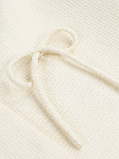 Apricot Bow Detail Cropped Outerwear by Trendsi, featuring a stylish bow accent and cropped fit in soft fabric.