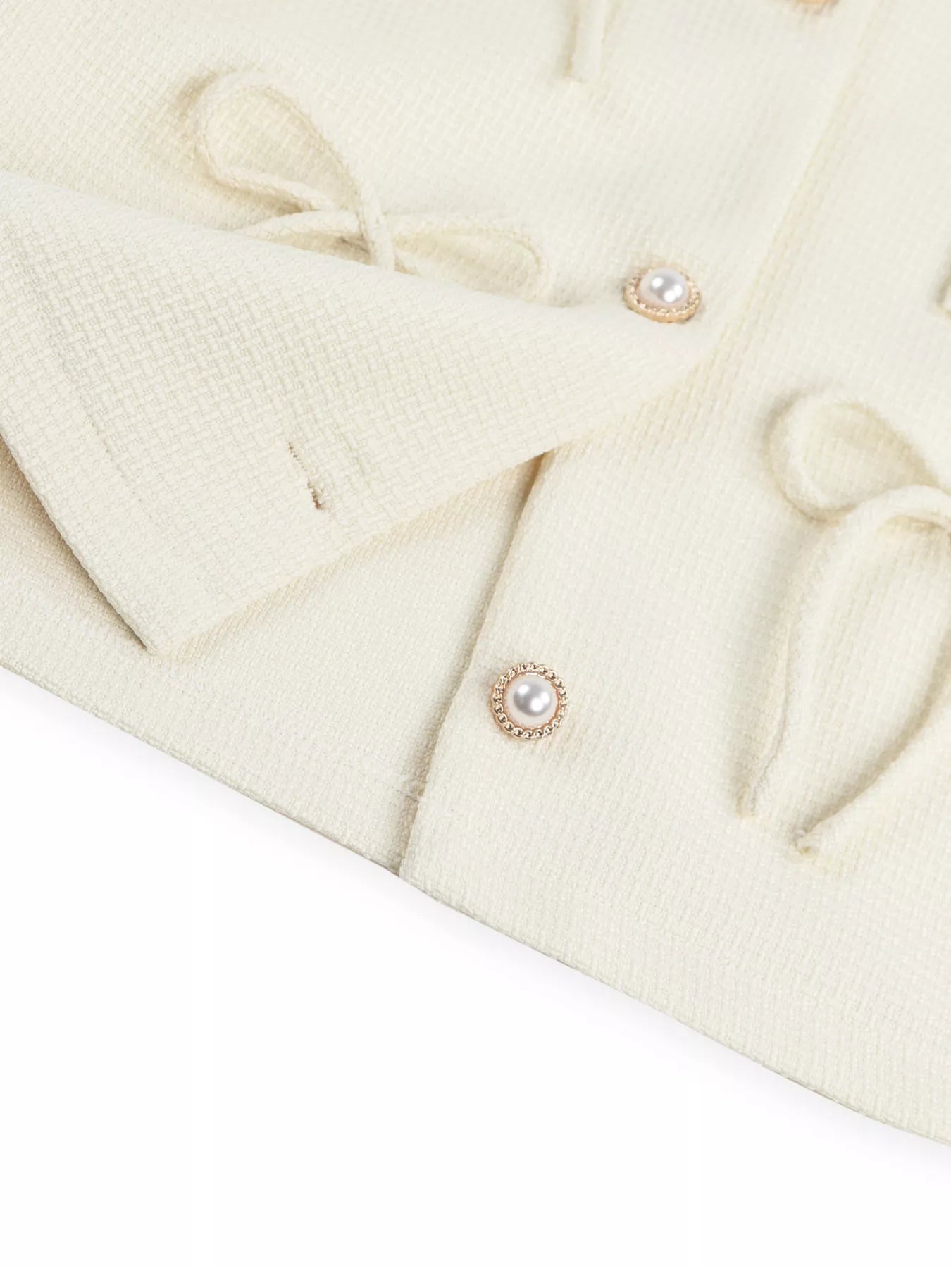 Apricot Bow Detail Cropped Outerwear by Trendsi featuring a stylish bow accent and cropped fit, perfect for layered fall outfits.