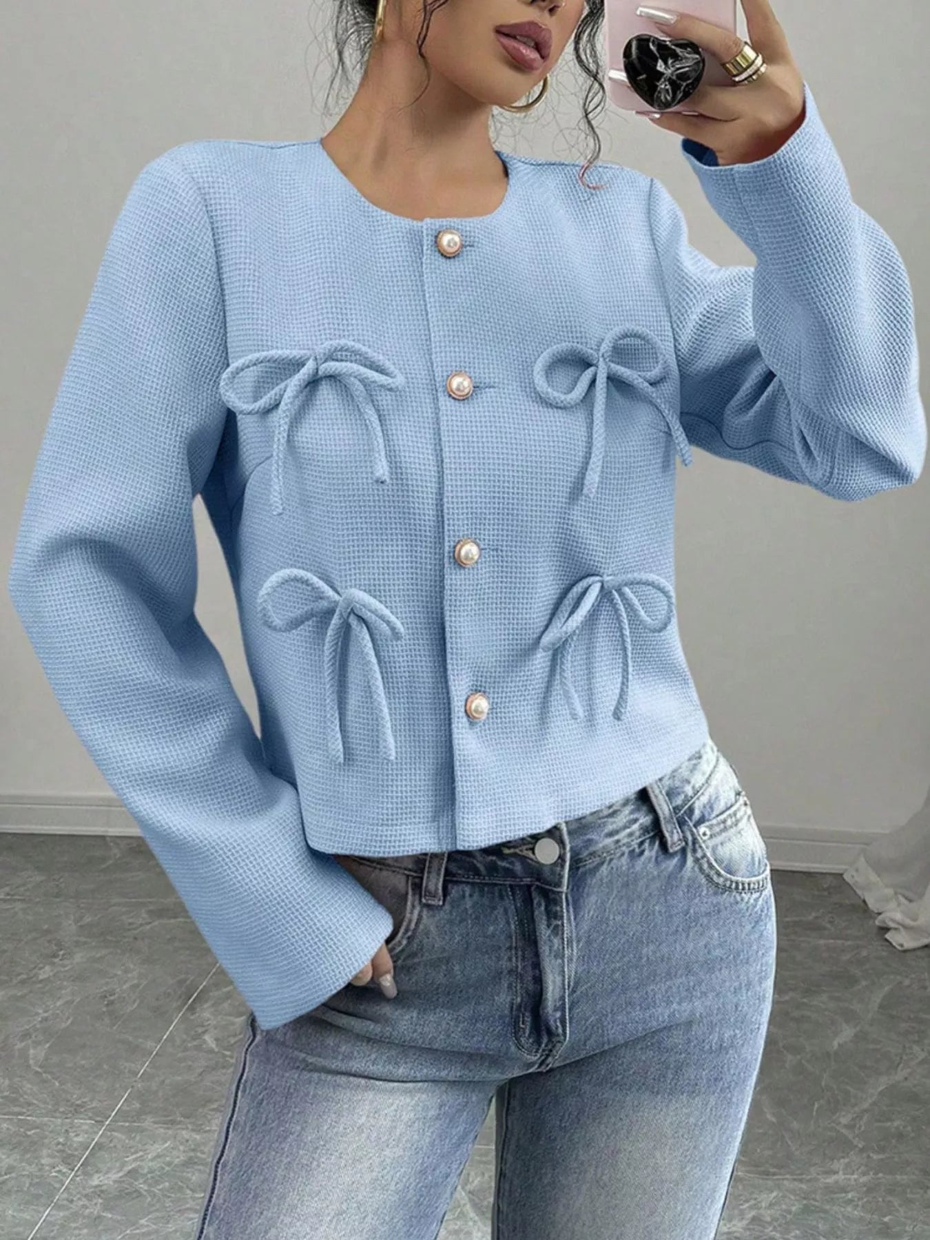 Apricot Bow Detail Cropped Outerwear from Trendsi, showing a stylish cropped jacket with bow accents and textured fabric.