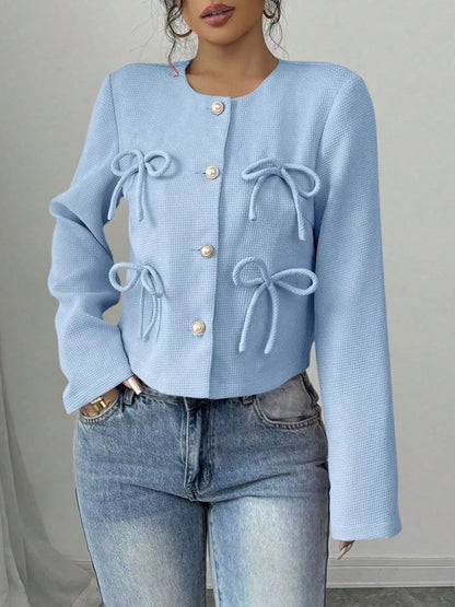 Apricot-colored Bow Detail Cropped Outerwear by Trendsi featuring a stylish bow accent and lightweight cropped design.