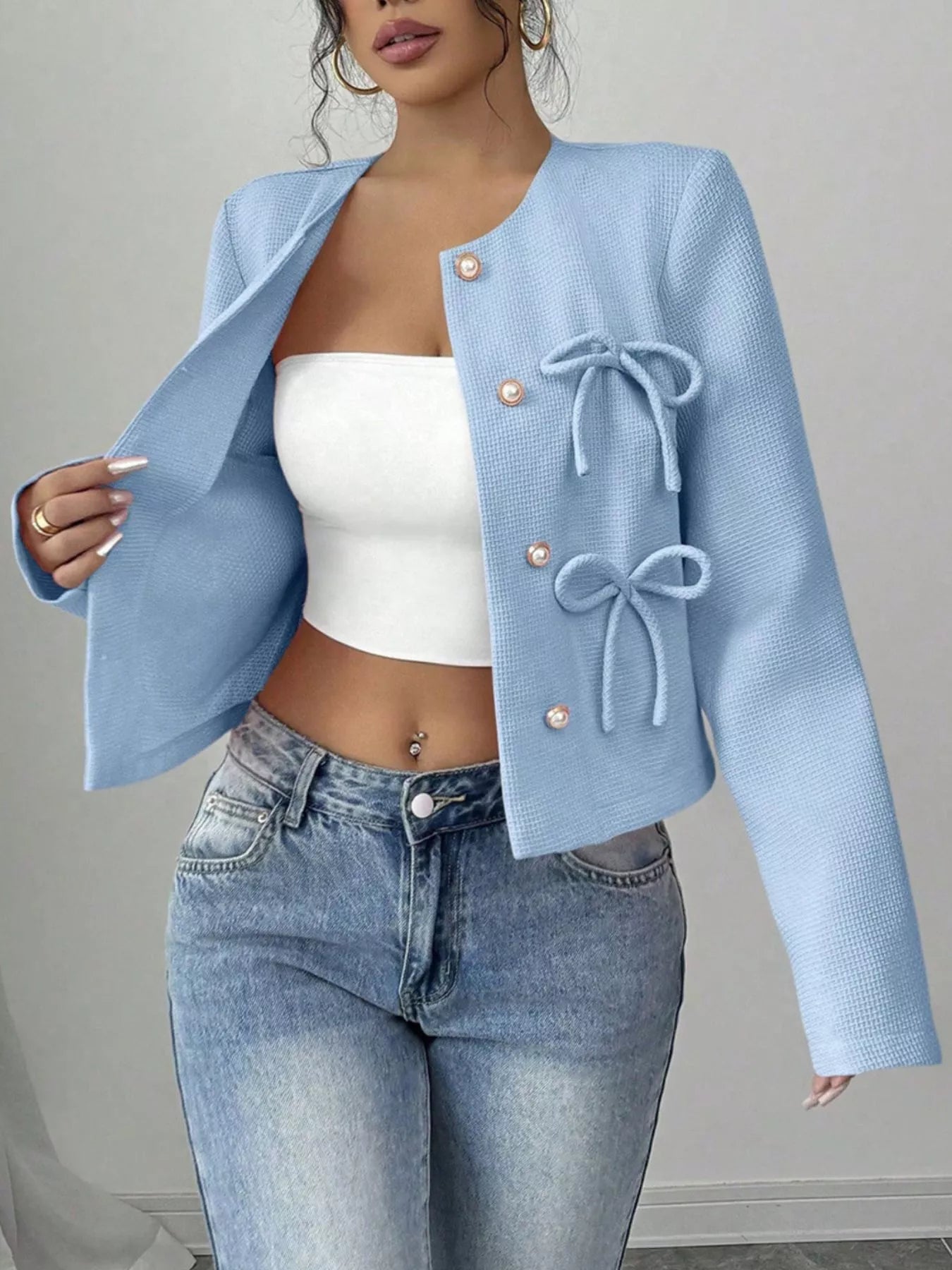 Apricot Bow Detail Cropped Outerwear by Trendsi, featuring a stylish bow accent and cropped fit in a soft, lightweight fabric.