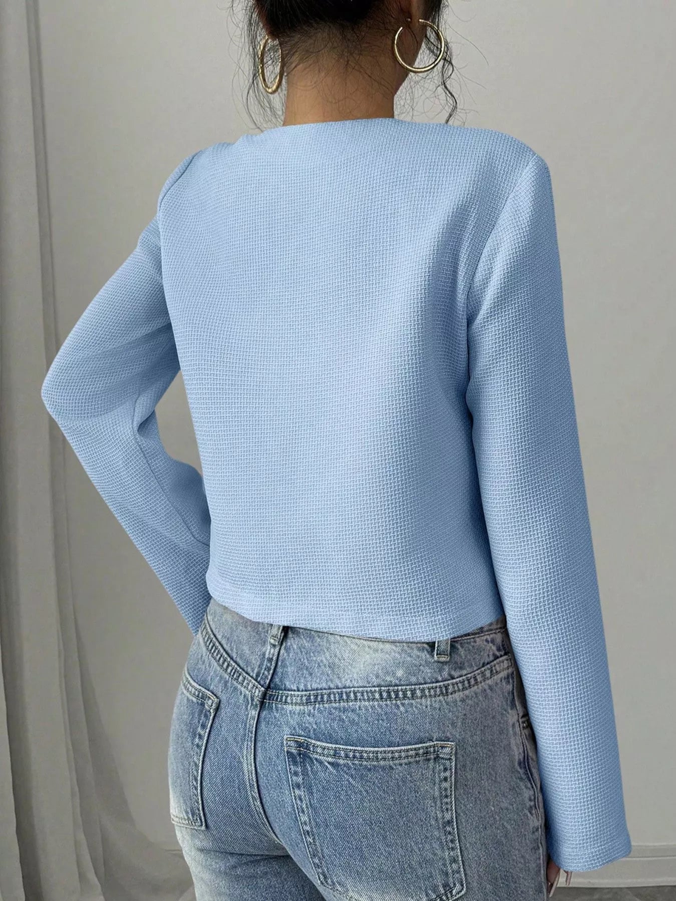 Apricot Bow Detail Cropped Outerwear by Trendsi featuring a bow accent and structured fit, perfect for stylish layered looks.