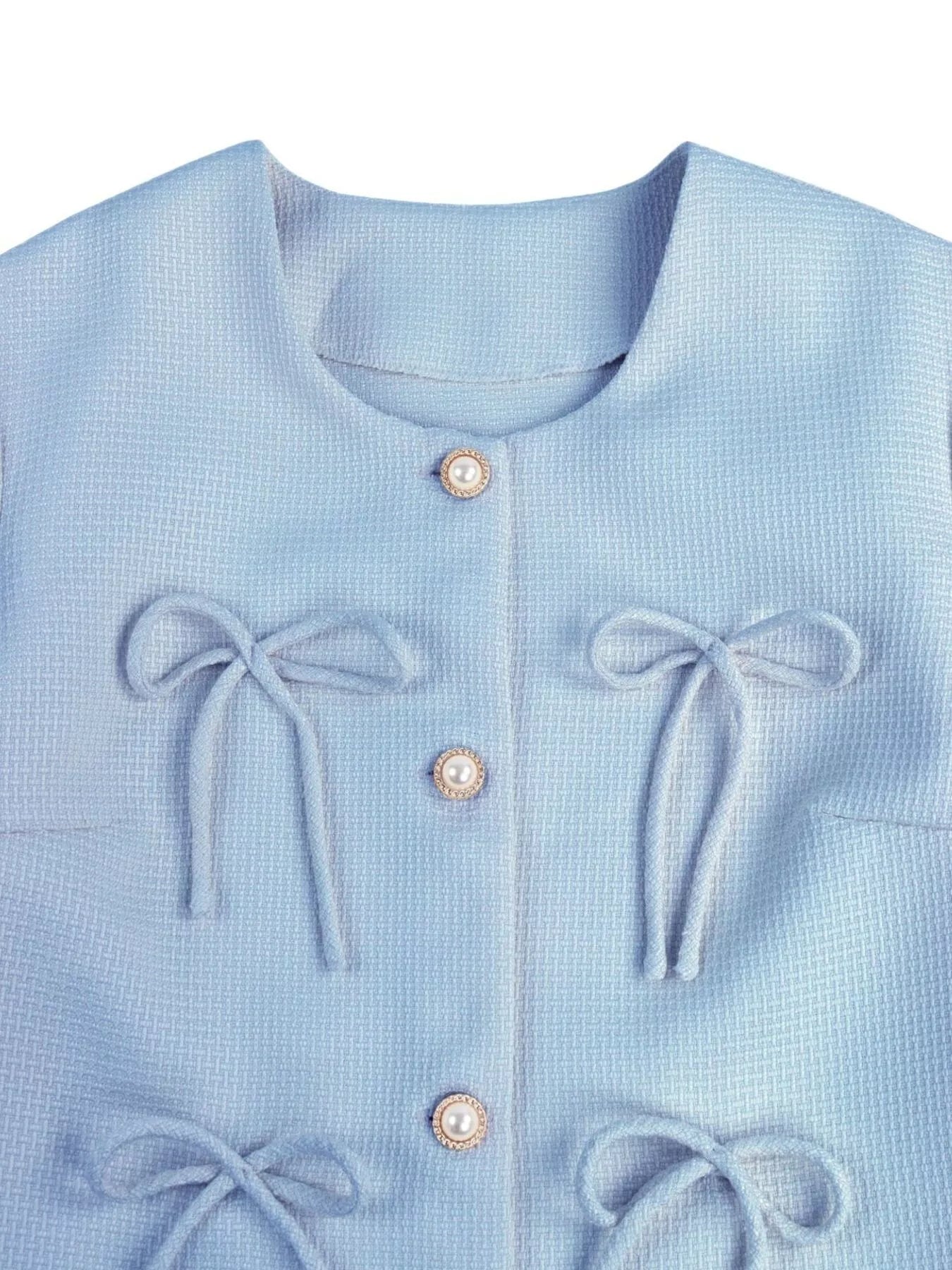 Apricot cropped outerwear with bow detail from Trendsi, featuring a stylish design and lightweight fabric for casual wear.